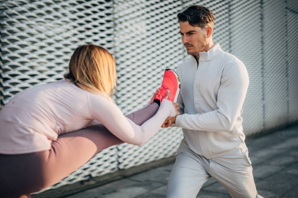 istock One beautiful couple stretching together before working out 1248521594