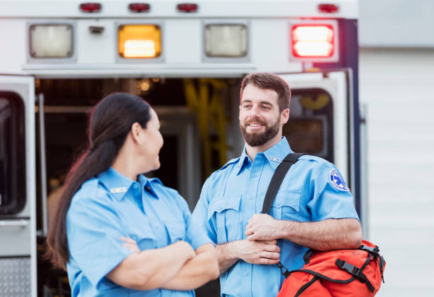 istock Paramedics standing at the rear doors of an ambulance 1248521596