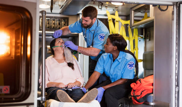 istock Paramedics helping woman in ambulance 1248522243