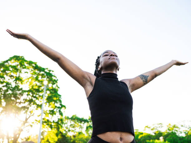istock Dancing African woman in the park 1248522289