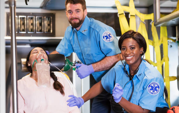 istock Paramedics helping woman in ambulance 1248522412