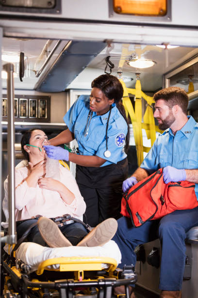 istock Paramedics helping woman in ambulance 1248522590