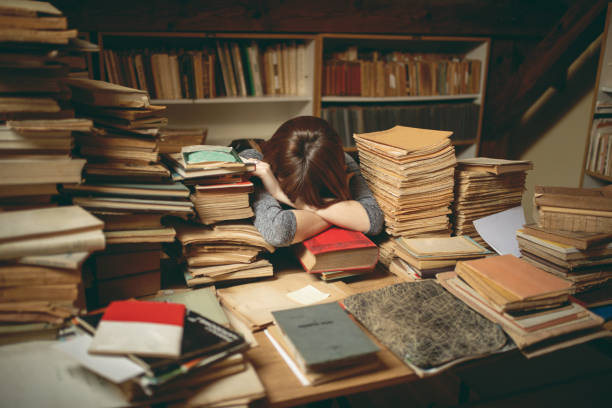 istock Beautiful young woman working in library 1248524099