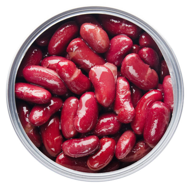 istock Flat lay view at opened tin can with kidney beans isolated on white background 1248524491