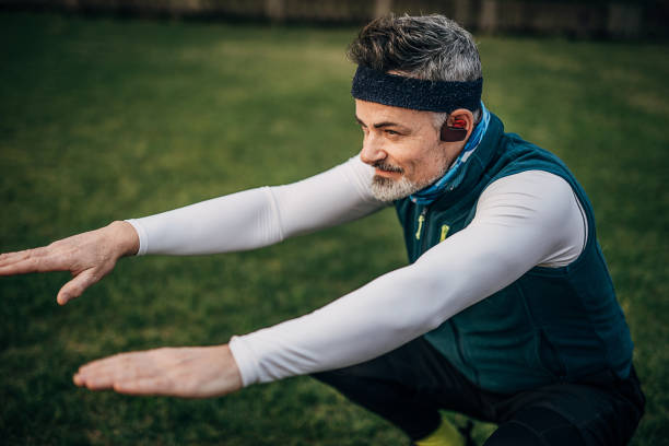 istock One mature man stretching before jogging in public park 1248526161