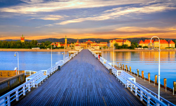 Holidays in Poland - The pier at dawn in Sopot Holidays in Poland - The pier at dawn in Sopot, spa resort at Baltic Sea. The pier is the longest wooden pier in Europe. gdansk photos stock pictures, royalty-free photos & images
