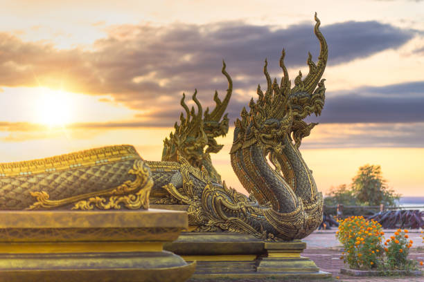 Sirindhorn Wararam Phu Prao is public Temple (Wat Phu Prao) at evening a glow of the sculpture of the Kalpapruek great Naga , which is attached to the wall behind the church.It will appear green glow in the night