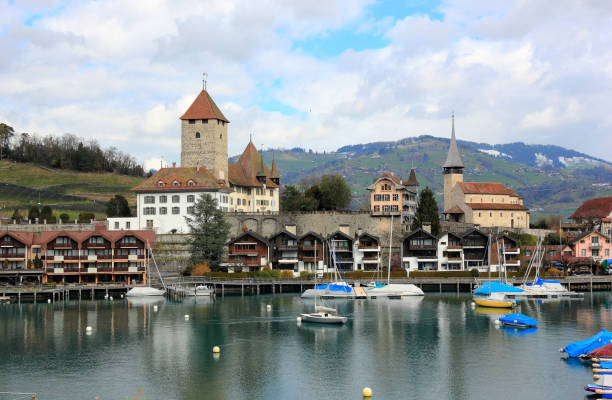 Spiez harbour, Spiez Castle and Lake Thun. Switzerland, Europe. Spiez, Switzerland - March 07, 2020: Visiting Spiez town on a sunny morning in March. Spiez is located on the southern shore of Lake Thun. thun interlaken winter switzerland stock pictures, royalty-free photos & images