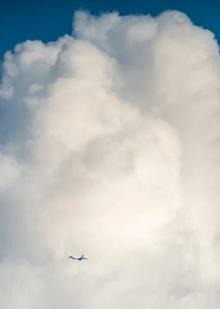 Airplane crosses thick clouds in Delhi India