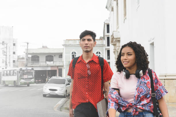 istock Young university students walking in a city street 1248528119