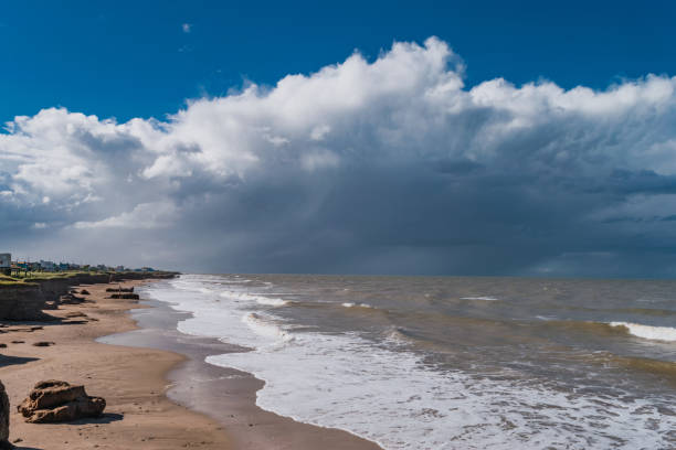 istock large storm clouds moving away over the blue sea 1248529414