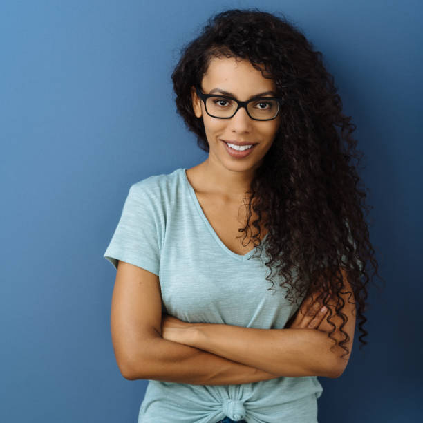 istock Young friendly woman with folded arms 1248529666