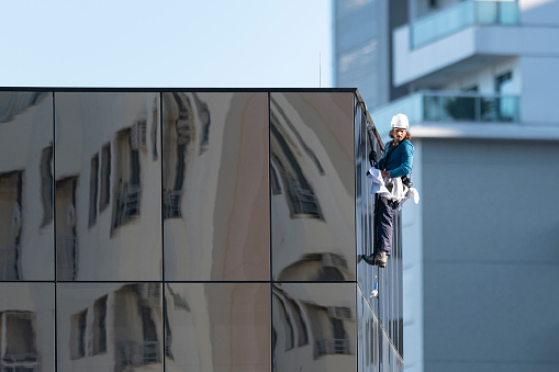 scenery reflection on brand new commercial office building glassy facade