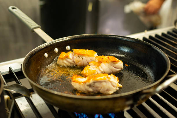 istock Seafood - Fish on a frying pan 1248530754