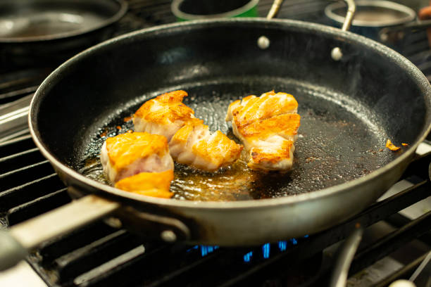 istock Seafood - Fish on a frying pan 1248530758