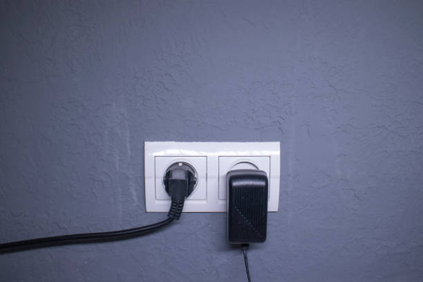 istock Sockets for electrical appliances on a light gray wall. a multifunction outlet 1248537293