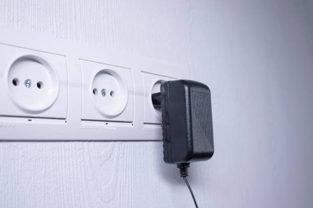 istock Sockets for electrical appliances on a light gray wall. a multifunction outlet 1248537383