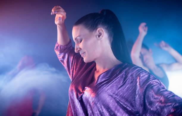 istock Woman Dancing At Night Club 1248537555
