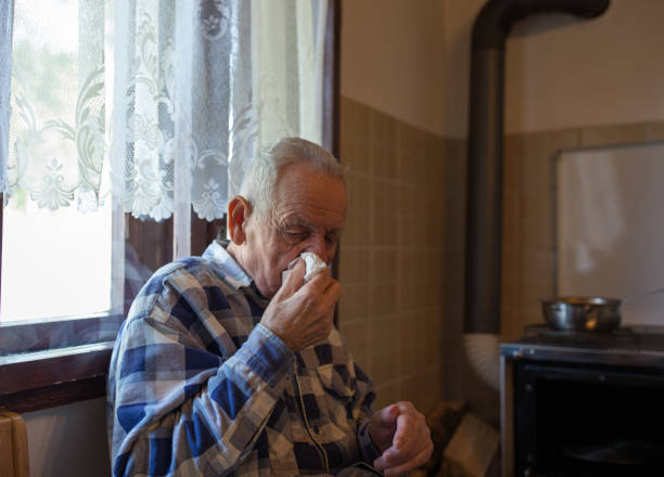istock Old man having flu at home 1248538592