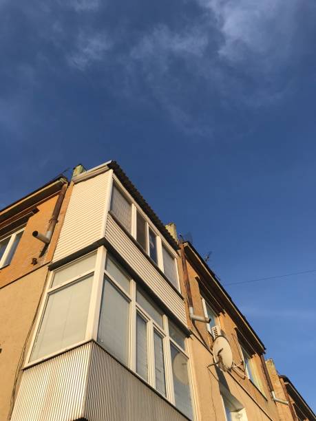 istock old house with glazed balconies against the sky 1248538730