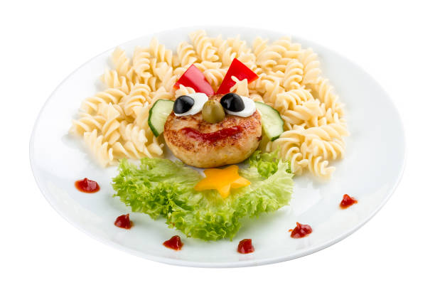 istock Children's menu. Chicken cutlet with pasta and salad. On a white background 1248541292
