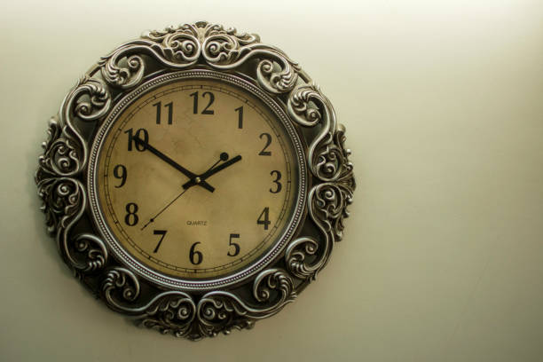 istock Ancient Wall Designer Wall Clock With Light Yellow Back Ground showing time 01.50 o'clock 1248543052