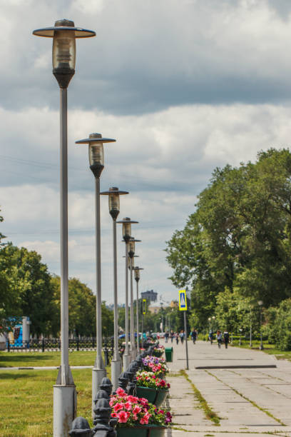 istock Lanterns in the city stand next to each other along the footpath. 1248543729