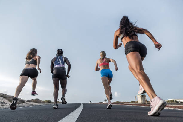 istock Unrecognizable diverse athletes running together 1248543990