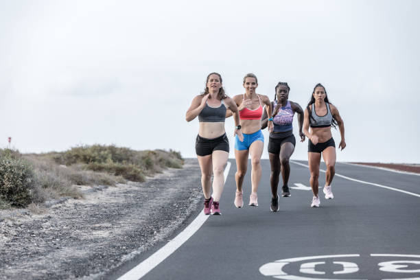 istock Multiethnic sportswomen running on dull day 1248544060