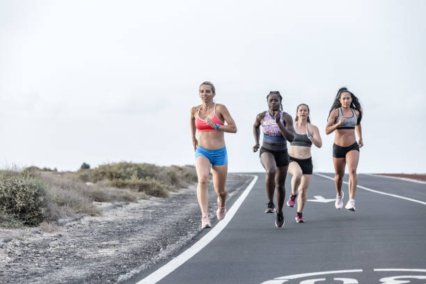 istock Strong diverse women sprinting in outskirts 1248544083