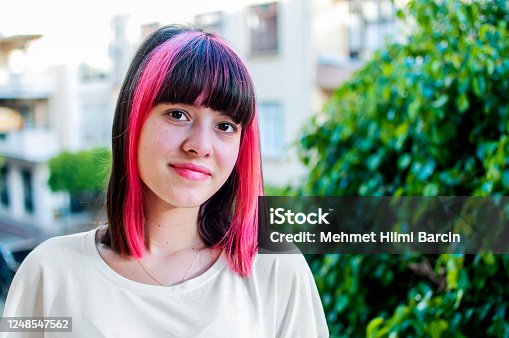 istock Teenager with pink hair 1248547562