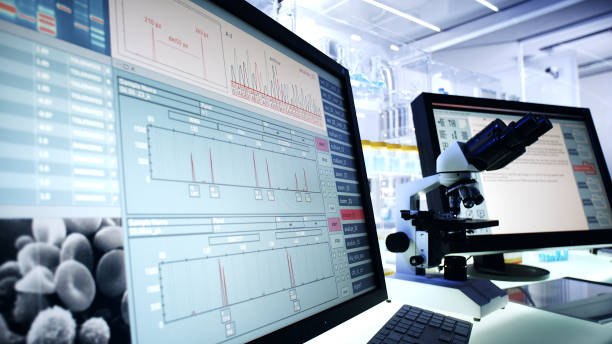 istock Futuristic laboratory equipment. Blood cells research on computer screens 1248549068