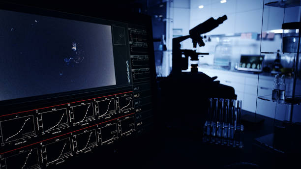 istock Futuristic laboratory equipment. DNA research on computer screens 1248549171