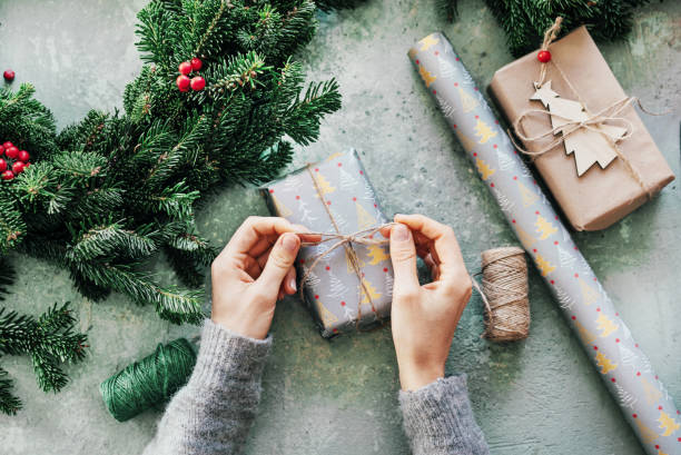 istock hands decorate christmas gift 1248549427