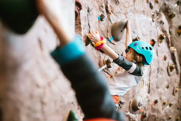 Photo of Children Climbing Indoor Rock Wall