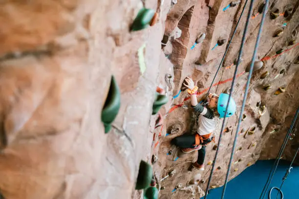 Photo of Child Climbing Indoor Rock Wall