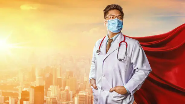 Photo of Doctor wearing medical mask . Super hero power for medicine. Corona Virus Covid 19