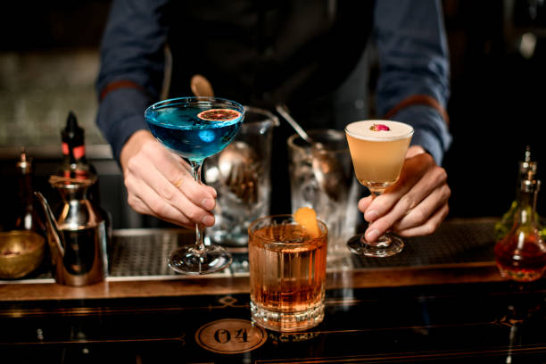 istock Close-up. Male bartender presents three different cocktails 1248552279