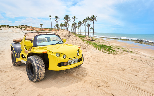 Yellow bug car in Lagoinha beach. Northeast of Brazil