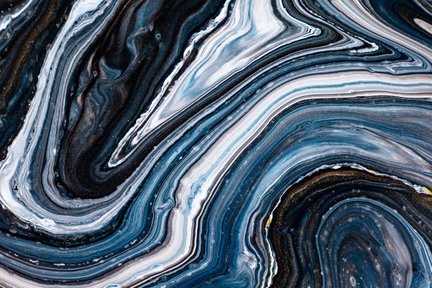 istock Fluid art texture. Abstract backdrop with swirling paint effect. Liquid acrylic artwork with artistic mixed paints. Can be used for baner or wallpaper. Black, navy blue and white overflowing colors. 1248556249