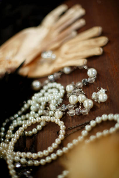 istock white pearl jewelry on a wooden background 1248558428