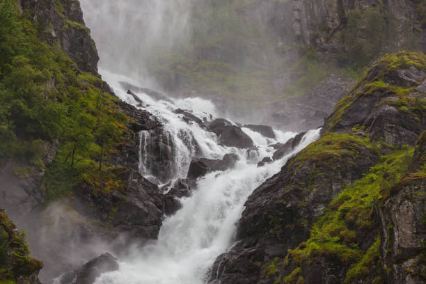 istock Stunning waterfall on the mountain river 1248560483