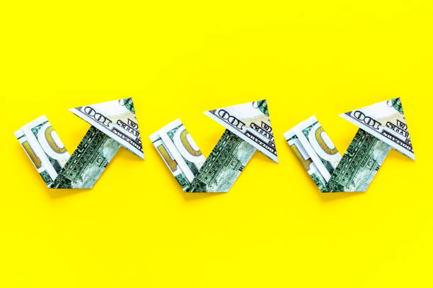istock Dollar chart on yellow background. Currency trading concept 1248561187