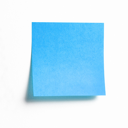 Blue sticky note isolated on white background, front view adhesive paper with copy space
