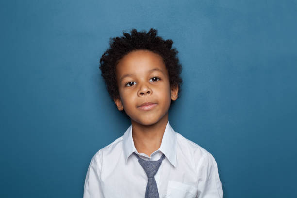 istock Handsome little black child boy portrait on blue background 1248564412