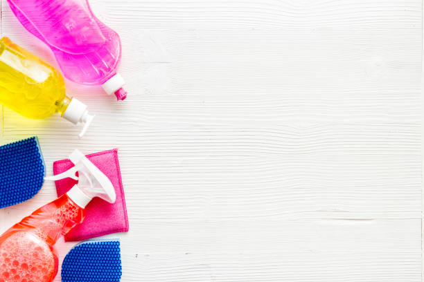 istock Detergent bottles, sponges on white stone table top-down space for text 1248564597