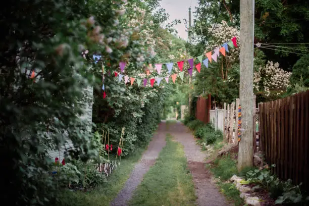 Photo of Montreal Alley with festive multi colored flags hanging