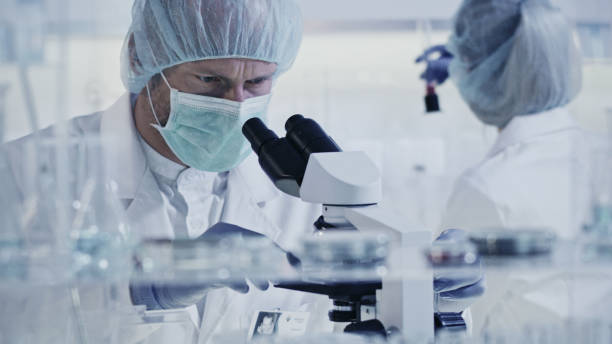 istock Working with biohazardous substance. Woman and man during research 1248569357