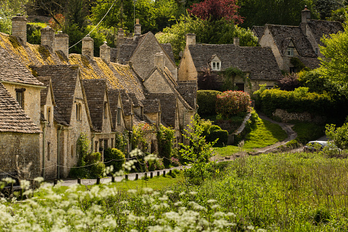 Bibury Arlington Row in The Cotswolds England. A traditional village built in Cotswold Stone.