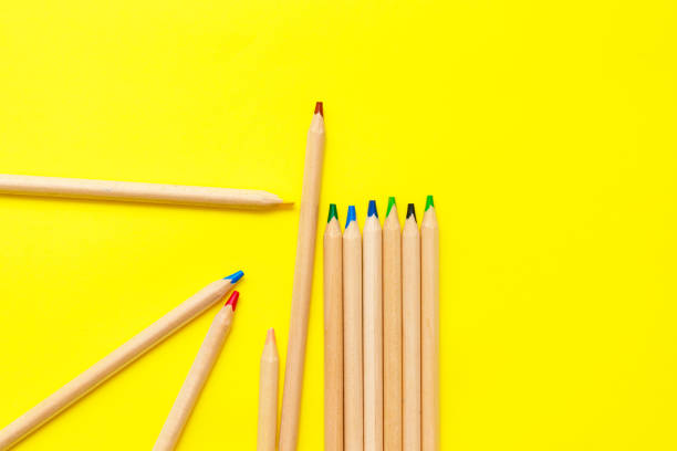 istock Modern sketch set with colour crayons on yellow background for banner design. Colorful abstract background. 1248569907